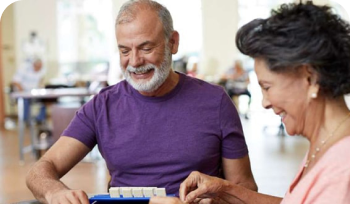 Husband and wife sorting medications
